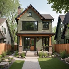 a large house with lots of windows and grass in front of the entrance to it