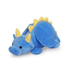 a blue stuffed dragon laying on its side