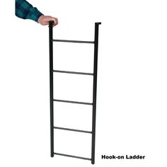 a person holding onto a ladder with their hand