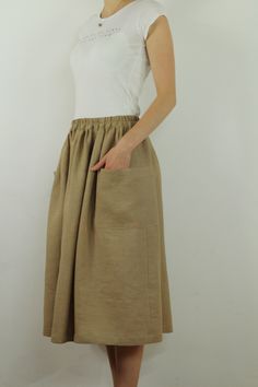 "Write the selected color in the message Handmade nut brown linen long skirt with pockets , perfect for casual wear and suitable for any occasion in any season Details: - 100% natural linen produced in Europe ; - medium weight (180 gram per square meter); - color: could be any from our colors catalog (color samples at the photo); Made to order, approximately a few days, If you have any questions please message me and I will be glad to answer. Size guide : Size XS Bust: fits bust around 33\"-34\" Khaki Midi Skirt With Pockets, Brown Midi Skirt With Pockets, Brown Flowy Maxi Skirt With Pockets, Cotton Brown Maxi Skirt For Spring, Brown Cotton Maxi Skirt For Spring, Spring Brown Cotton Maxi Skirt, Brown Cotton Summer Skirt, Summer Cotton Brown Skirt, Khaki Wide Leg Skirt With Pockets