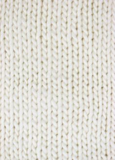 the texture of white knit fabric as a background