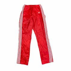 Vintage Adidas Trefoil Logo Men's Red White 3-Stripe Nylon Swishy Elastic Waist Warm Up Track Pants Tag Size MEDIUM Most pre-owned pants will not measure exact to the tag size. To insure fit, compare actual flat measurements below against your favorite pants at home. Flat Measurements: Waist: 13 in (minimum elastic) Rise: 12 in Inseam: 32 in Condition: This is a clean, quality pre-owned pair of pants. Signs of light wash and wear should be expected. Significant flaws will be listed below. Flaws: Adidas Sports Nylon Pants, Adidas Nylon Sports Pants, Adidas Nylon Bottoms For Streetwear, Casual Nylon Adidas Pants, Casual Adidas Nylon Pants, Sporty Red Full-length Sweatpants, Adidas Three Stripes Pants For Streetwear, Adidas Sporty Parachute Pants For Streetwear, Sporty Red Jogging Pants