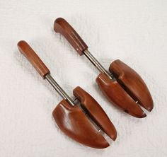 This listing is for a pair of matching right and left vintage wooden shoe trees, model #3 Mohawk.  They are in very good condition clean with no damage and work as they should but there is some light surface rust on the metal parts.    Measure roughly 11-1/2" long x 3-1/2" wide.  Made in the USA by Rochester Shoe Tree Co. New York  They don't make things of quality like this anymore.  You can use them as intended or as a decorative piece in your home.   Because this is a used vintage item please look at the photos carefully and any question you may have we will be happy to answer them for you. Fun to do crafts, Mixed Media, Assemblage Art, Home Decor and more!   ----------------------------------- FYI: Shipping is estimated by USPS based on distance, size, and weight of package. To be Insp Wood Shoe, Wooden Shoe, Wood Shoes, Wooden Shoes, Shoe Tree, Shoe Insoles, Garden Trowel, Store Decor, Crafts To Do