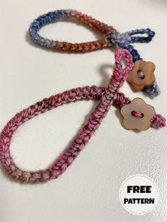 two bracelets with flowers on them sitting on top of a white table next to the words free pattern