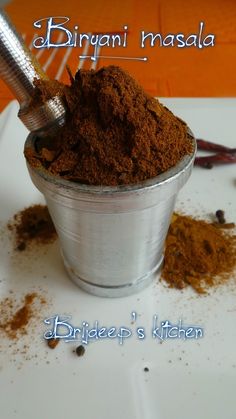 a cup filled with dirt sitting on top of a table