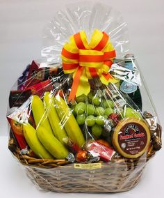 a basket filled with assorted fruit and snacks