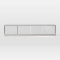 a white cabinet sitting on top of a floor