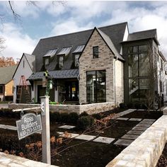 a brick house with a sign in front of it that says, builders of insta