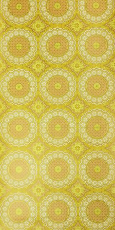 a yellow and white wallpaper with circular designs