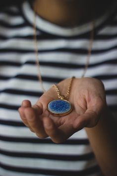 Use extra special care when cleaning color enhanced or delicate natural beads including turquoise, red coral, bone, and pearls. Holding Necklace Reference, Holding Necklace Pose, Hand Holding Necklace, Holding Necklace, Necklace Reference, Emf Radiation, Blue Pendant Necklace, Stylish Necklace