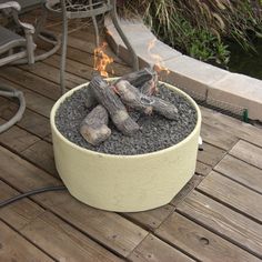 a fire pit sitting on top of a wooden deck