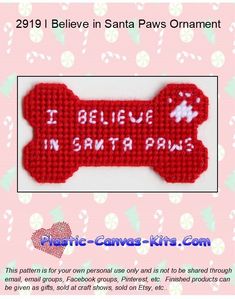 a cross stitch dog bone with the words i believe in santa paws written on it