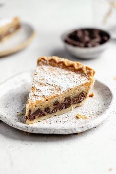 a piece of pie sitting on top of a white plate