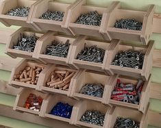 several boxes filled with lots of different types of screws