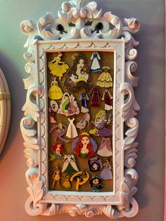 an ornate frame with many disney characters on it