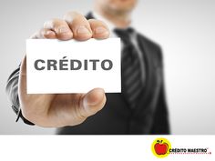 a man in a business suit holding up a card with the word credit on it