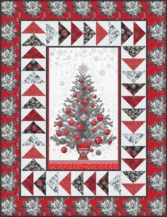 a quilted christmas tree with red and silver ornaments on it's center piece