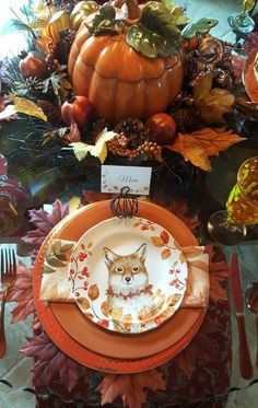 an orange and white plate with a corgi design on it, surrounded by fall leaves