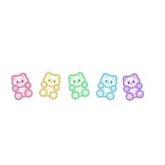 four teddy bears in pastel colors are lined up against a white background, with one bear facing the opposite direction