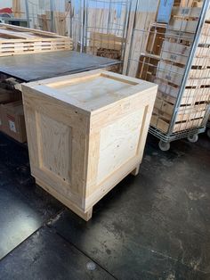 a large wooden box sitting on top of a floor