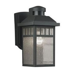 an outdoor wall light with frosted glass on the front and side panels, black