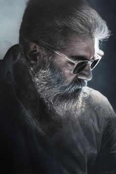 an old man with glasses and a beard looks off to the side in front of a dark background