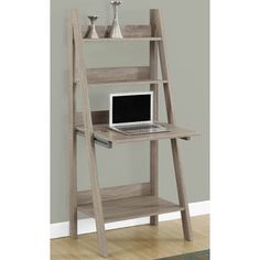 a wooden ladder desk with a laptop on it