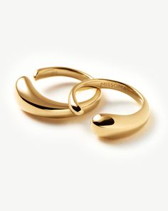 Molten Double Stacking Ring Set | 18ct Gold Plated. Make It Molten. This Organic-Inspired Ring Set Features Two Sculptural Bands that Fit Together to Create One Statement Ring. Style Separately or Stack Together. Metal: 18Ct Recycled Gold Plating on Brass Dimensions: 13. 7Mmx 5. 5mm Weight: 6. 6g Product Code: Or-G-R2-Ns 14k Gold Plated Yellow Gold Rings, 14k Gold-plated Yellow Gold Rings, 14k Gold Plated Rings For Anniversary, 14k Gold Plated Rings, Luxury Yellow Gold Couple Rings With Polished Finish, Luxury Yellow Gold Plated Ring, Modern Couple Rings Tarnish Resistant For Anniversary, Modern Yellow Gold Couple Rings With Ring Detail, Luxury Gold Stackable Rings With Polished Finish