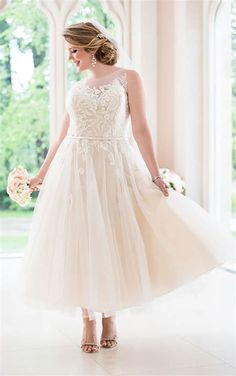 a woman in a wedding dress holding a bouquet