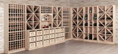 a room filled with lots of wine bottles and wooden shelves next to a brick wall