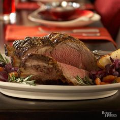 a white plate topped with meat and vegetables