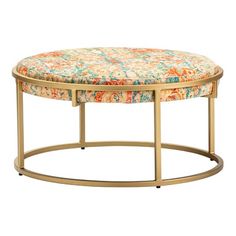 an orange and blue floral ottoman with gold metal frame, round foot rest on white background