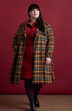 The issue here is that everyone is going to want to know where you got this super unique and stylish plaid trench coat! In an exclusive plaid print from our ModCLoth namesake label, this fully-lined trench boasts double-breasted button-up closure, a notched lapel collar, button-tab closure at the long sleeve cuffs, a smart tie-waist belt, and handy side pockets. Finishing at the knee with a darling skirted silhouette, this gorgeous and cozy peacoat is an entire outfit unto itself. Plus Size Peacoat, Plus Size Vintage Clothing, Fit And Flare Coat, Designer Plus Size Clothing, Plaid Trench Coat, Teacher Outfits Fall, Outfits 70s, Statement Outfit, 70s Outfits