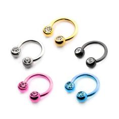 three different colored nose rings with crystal stones