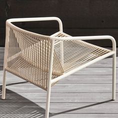 a white chair sitting on top of a wooden floor