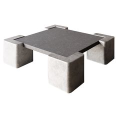 a concrete table with two square legs