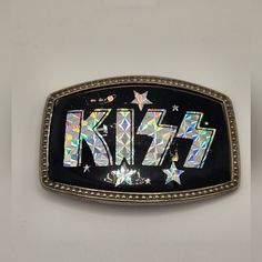 This Is A Collectible And Vintage Kiss Rock Band Belt Buckle With The Silver Prism Logo And Stars And Planets. Circa 1977 Or 1978. It's Stamped 681 On The Back. Is Has Slight Wear And Some Scratches On It. It's In Pretty Good Condition Considering How Old It Is. There Were Silver, Gold, Red, Green, Yellow, And Pink Version's Made At The Time. It's Definitely Vintage And A Rare Piece. Perfect For Hard-Core Kiss Fans, Collectors, Or Anyone Who Wants To Own A Piece Of Rock & Roll History. Look Arou Prism Logo, Kiss Rock Band, Rock And Roll History, Vintage Kiss, Vintage Belt Buckles, Vintage Belt, Vintage Belts, Vintage Band, Rock Roll