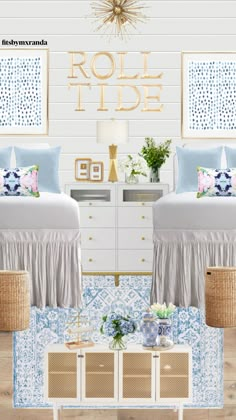 two beds in a room with blue and white decor