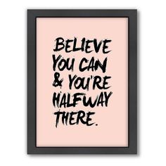 the words believe you can and you're halfway there are black ink on a pink background