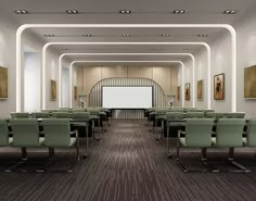 an empty conference room with chairs and a projector screen in the center, along with paintings on the walls