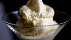 three scoops of ice cream in a glass bowl