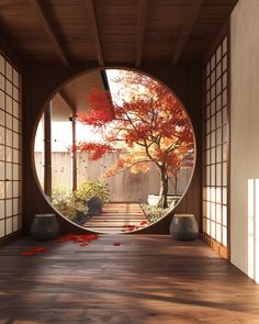 an empty room with red leaves on the floor and a tree in the middle of it