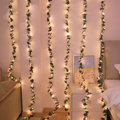 some lights that are on the side of a wall in a room with a bed