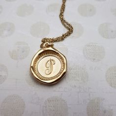 "Monogram Initial letter \"P\" Materials: Silver, Gold, Gold vermeil Gold vermeil is a thick 24k layer of gold over a solid sterling silver base. Size: Approx 3/4\" {21mm} The antique wax seals used to make my initials are mostly around 170 yrs but can be as young as 70 yrs, and as old as 750+ yrs old (My letter i). As each wax seal was individually collected, I am unable to change the font or size. They are only available as shown. PLEASE NOTE: Before you order please check sizing information - it can be hard to gauge jewelry sizes from pictures alone. On some of the seal pieces the text is so small as to be read only with a magnifying glass making the meaning a secret between you and those you choose to tell. Availability and shipping Your purchase will ship in 3-5 business days. Once sh Shark Heart, Shark Charm, Monogram Wax Seal, Shark Jewelry, Seal Jewelry, Jewelry Letter, Seal Necklace, Shark Pendant, Wax Seal Jewelry