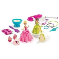 barbie doll and kitchen accessories on a white background with food items in the foreground