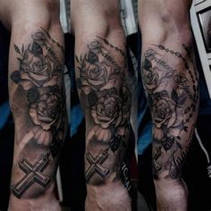 tattoos on the legs of a man with roses and crosses in them, all over his arm