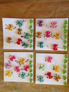 four pieces of paper with colorful flowers and words written on them, sitting on a table