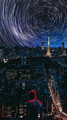 a spider man looking at the stars in the night sky over a cityscape