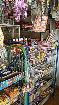 a store filled with lots of different types of food and snacks on shelves next to each other