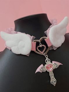 Elevate your Kawaii fashion game with our rhinestoned cross pendant blue/pink Jirai Kei angel wings PU choker. This stunning choker features a delicate PU leather band adorned with a rhinestoned cross pendant in a choice of blue or pink, perfectly capturing the ethereal essence of Jirai Kei style. The angel wings design adds a touch of whimsy and fantasy, making it a must-have accessory for any Kawaii wardrobe.  Please note that this product includes the choker only. Pink Harajuku Style Jewelry For Parties, Pink Gothic Jewelry, Pastel Goth Jewelry, Pink Wings Angel, Cutecore Accessories, Chokers Aesthetic, Angelic Accessories, Angelic Fashion, Cute Accessories Kawaii